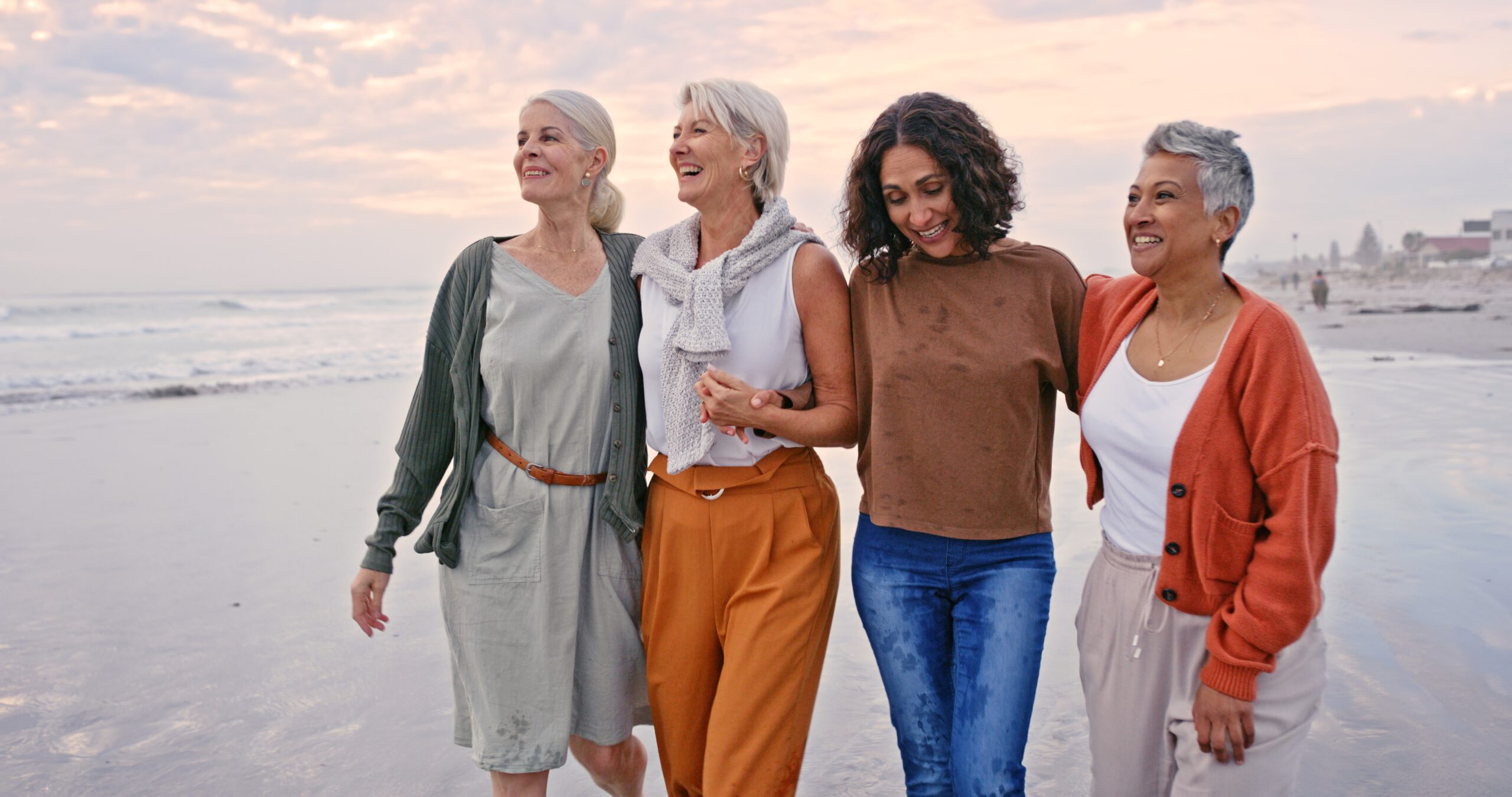 Women on beach — community and connection